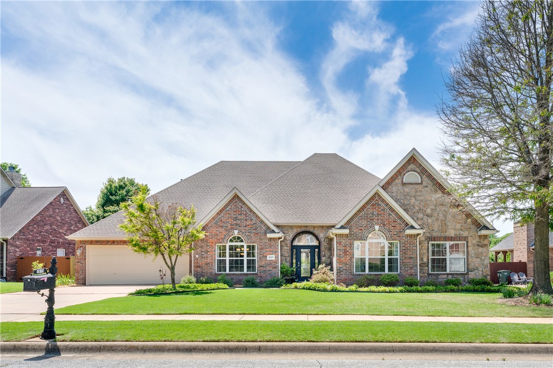 Welcome to this beautifully designed 4-bedroom, 3-bath home in Fayetteville, offering comfort, style, and functionality. Featuring two living areas, including a spacious entry living room and a second living space that flows seamlessly into the dining area and eat-in kitchen—ideal for both everyday living and entertaining. The primary suite serves as a private retreat, featuring a walk-in shower, jetted tub, dual vanity and a generous walk-in closet, along with direct access to a covered back patio with a skylight—perfect for relaxing mornings or quiet evenings while additional bedrooms offer versatile space for guests or a home office. Step outside to your backyard oasis, where the custom pool and serene setting create a relaxing escape, making this home special, and the extra-large covered back porch is ideal for entertaining. Conveniently located near the University of Arkansas, Gulley Park and popular shopping and dining, this home offers easy access to top amenities in a comfortable residential setting.