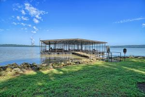 If you are tired of mowing and would rather fish instead check out this luxury Condo on Lake Dardanelle offers upscale living with small town community. Great lake views are available from the large deck. Fish off the shore line or from your boat! Community boat dock and your slip has a lift. Inside this 3 bedroom, 2.5 bath home you will find dark wood flooring, ornate tall ceilings, granite countertops, fireplace, and 2-car garage