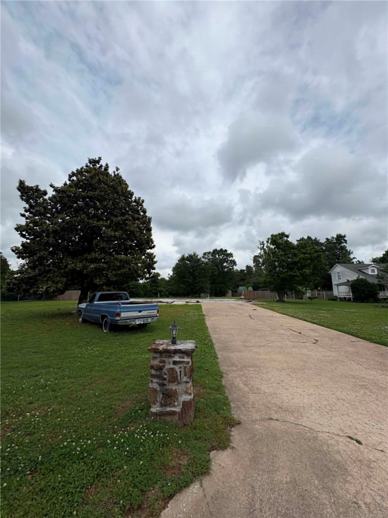 Build your next home or investment property on this level, cleared 1.09 acre lot in Edgewood Suburban Estate Rurban, just outside Siloam Springs city conveniences. Located in the Siloam Springs School District, this spacious corner offers public water, sewer, electric, and gas available at the street, plus partial fencing and paved public road access. Manufactured homes are allowed, giving you flexible options for affordable living or rental income. No covenants and low county taxes make this a rare find in Benton County.