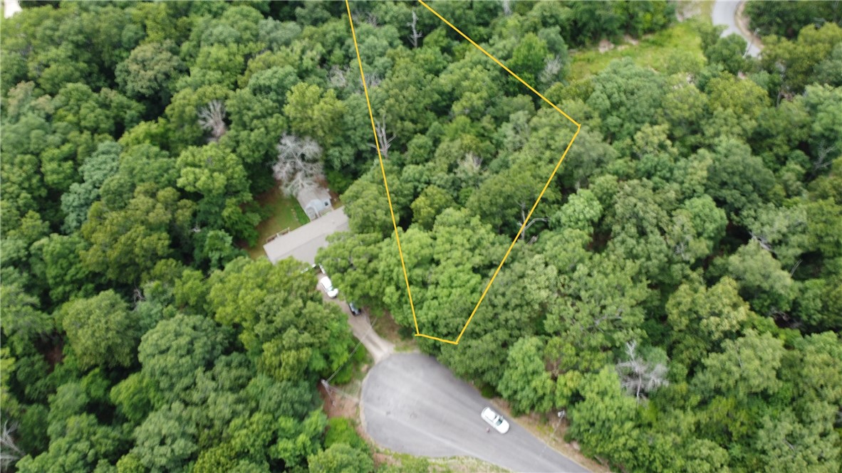 Over half an acre lot touching the Back 40 Trails!!! Only 5 minutes to the highway and close to lakes and shops. The lot is gently rolling, relatively flat and the