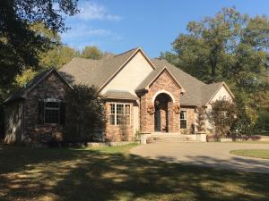 IMMACULATE Luxury home features 12' ceilings in entry & living room,9'through out. Home has custom cabinets, hardwood floors, stainless appliances,butler pantry, indoor and outdoor fireplace, 4 bedrooms 3 baths, tile, formal dining, office, surround sound, vacuum system,granite, 32x18 straight side kidney in-ground pool, outside lighting, circle drive, privacy fence. Have to see to appreciate!