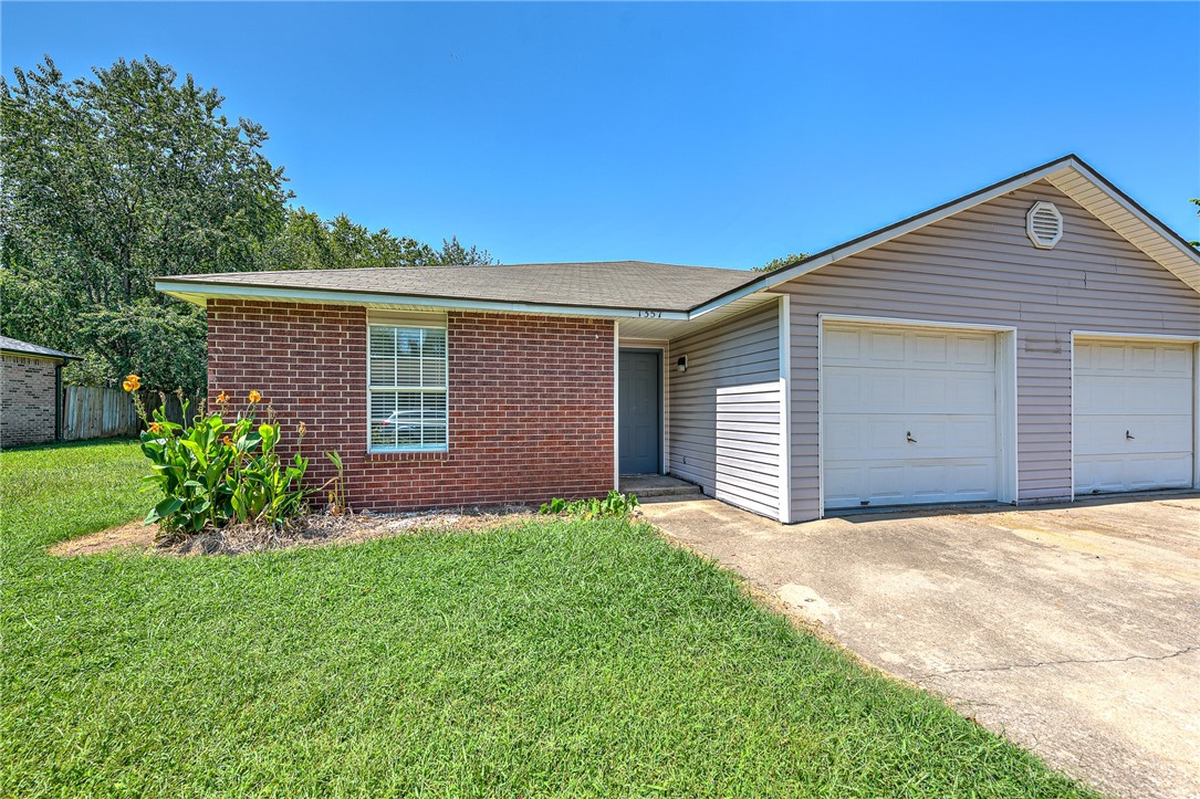 Perfect starter home or investment property in West Fayetteville! Freshly remodeled townhome (3 bedroom, 2 bathroom, 1 car garage per side) with new flooring, paint, counter tops, refinished cabinets, and new lighting & plumbing fixtures throughout. Brand new kitchen appliances including Refrigerator! Kitchen pantry, and washer/dryer hookups, too. Conveniently located less than 2 miles from I-49 and only 3.5 miles to the UofA. Close to bus routes, schools, shopping, restaurants, and all amenities Fayetteville. Come see this property today! The unit next door, 1359 N Boxley Ave, is also for sale, see ML#1254432.
