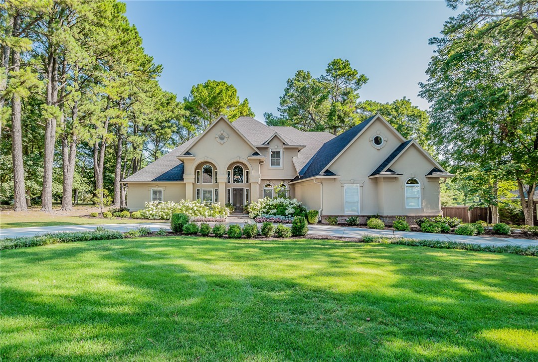 Welcome to this elegant home nestled in one of the most coveted pocket neighborhoods. This hidden gem is located in the best location while offering the privacy and tranquility of a secluded retreat. Every detail is magazine-worthy with notable features including a beautiful 2-story foyer, hardwood flooring, plantation shutters, marble and quartz countertops, custom millwork, designer lighting with oversized windows and doors along the back of the home. The main level features a dining room, multiple living and entertaining areas, a gourmet kitchen, and utility/mudroom. The primary suite and a secondary bedroom and full bath are also comfortably located on the main level. Upstairs leads to two additional bedrooms, full bath with coffee/wet bar, game/bonus room, exercise room, and an office/hobby room with wall-to-wall cabinetry. The lush backyard is a delight with a spacious terrace for entertaining, dining and relaxing, while overlooking the park like backyard. Agent owned.
