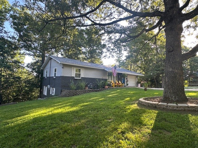 Remodeled move-in ready absolute gem in highly desirable Pines Subdivision on E Mountain Dr between E Van Buren (Hwy 62) near Historic Downtown Eureka Springs, near Crescent Overlook. All Luxury Vinyl Plank Wood-Finish flooring, remodeled kitchen, all new appliances, new interior doors & hardware, updated bathrooms,  new paint, new ceiling fans & more. Features 4 Bedrooms (or 3+ Flex), 2 Full Bathrooms, modern Kitchen with granite counter tops, large deck with stunning nature views, central AC & Heat, functional finished basement with Family Room/Game Room & Wet Bar, attached Garage & Utility Room AND a large workshop with separate entrance. All this plus two driveway/parking areas and a separate rear access which could turn the lower level into a private suite.
Zoned R2 Contemporary Residential. Nightly rentals not allowed. Long term rentals OK.
AGENT OWNED. Main Level 1,188 sq ft + Finished Basement 812 sq ft = 2,000 total sq ft fully finished with HVAC.