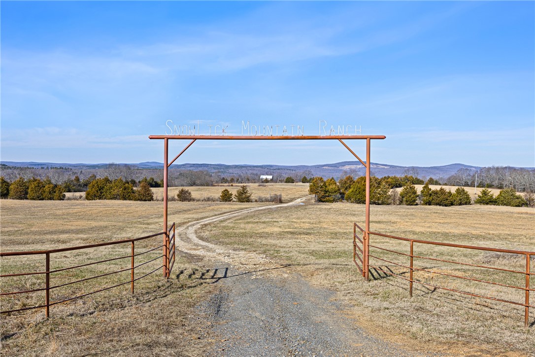 This is a once in a lifetime opportunity! The Snowlick Mountain Ranch includes 317.78 Acres and Panoramic views for miles. With roughly 100 Acres of manicured fields, 4 ponds and the remaining prime hunting ground with napier creek running along the southern border. This tract was previously a high fence ranch with miles of 8 foot fence still remaining. The Brand New Custom built (Timber Frame) Cabin is like something you'll only see from a magazine. Every Log, board and Peg that built this Cabin was harvested from this property, it's so incredible to see the craftsmanship and perfection that went into this build. The Cabin is 5,600 Sqft Heated and Cooled with the garage area included. Upstairs in the main living area is 2,800 Sqft 2 Bedrooms and 3 Full bathrooms. THIS WILL NOT LAST LONG!