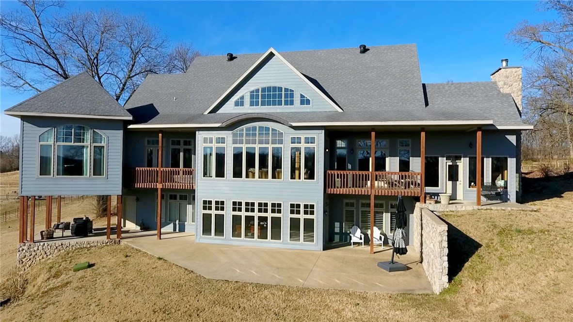 This is your chance to own one of the finest properties in all of Arkansas sitting on nearly 40 acres.It includes 40x30 separate garage w/heat & air,50x80 Red iron metal insulated shop, additional 20x80 covered storage,  4 garages/4 infrared heaters,20x40 Horse barn/Dog kennel, 20x60 Quansit hut, 2 wells, cattle working system,200x100 pipe corral w/horse barn. Inside features stunning woodwork,views/natural light, bonus/wet bar, executive office/fireplace, massive laundry room, & real wood floors.