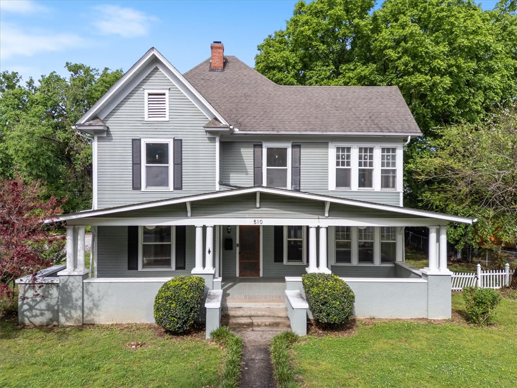 Step into a rare piece of Siloam Springs history with this early-1900s home full of timeless character and charm. Original features shine throughout, including beautiful woodwork, tall ceilings, built-ins, and a grand staircase that highlights the home’s historic appeal. With over 3,000 square feet, the layout offers multiple living areas, spacious bedrooms, and plenty of natural light. Situated on a large lot with inviting front and back porches, plus a detached garage with shop space, this property offers great bones and incredible potential. Located within walking distance to downtown Siloam Springs shops and restaurants, this is a rare opportunity to restore, invest, or create something truly special. With endless potential, this home is ready for the next owner to bring their vision to life! 
Agent is related to the Seller.