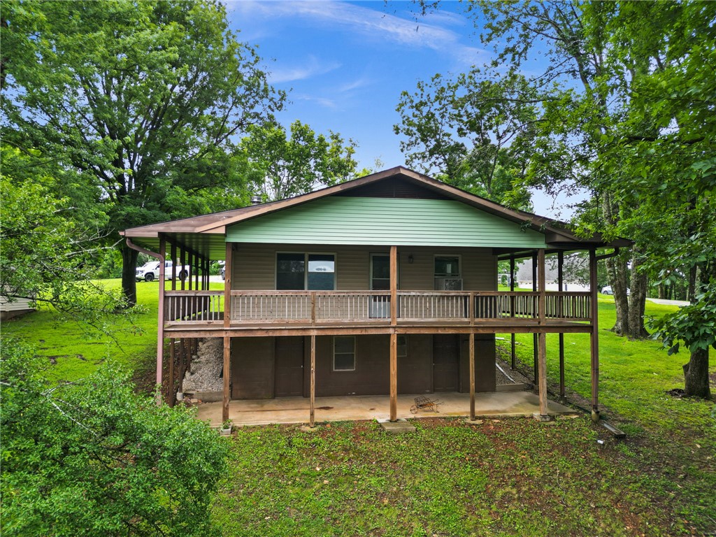 Investor Special in the Lost Bridge area of Beaver Lake. This approximately 1,600 square foot home is brimming with potential and ready for a complete renovation. Nestled in the highly desirable North end of Beaver Lake, the property offers an exceptional opportunity for investors, flippers, or buyers looking to create their own custom retreat. With solid bones and a prime location, this total fixer upper can be transformed into a charming full-time residence, weekend getaway, or a vacation rental.  Bring your vision and tools to unlock the value of this diamond in the rough and enjoy all the recreation, natural beauty, and outdoor lifestyle the Beaver Lake area has to offer.  Both levels unfinished...Sold AS-IS, with endless possibilities for the right buyer. Schedule your showing today!