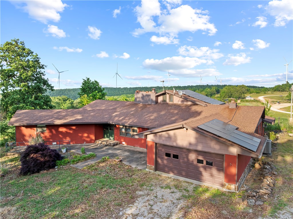 Rare opportunity to own a home on just over 70 acres of scenic countryside with incredible views and built-in income. Located adjacent to a wind farm, the property will include a lease agreement providing annual income through an easement road access arrangement, with payments scheduled to increase over time. There is a spacious 3,837 sq ft farmhouse on the property offering 5 bedrooms, 3 bathrooms, a massive custom kitchen, added cooking space in the enclosed back porch and a bonus room upstairs. The property also includes 2 shop buildings and a partially intact chicken house offering additional storage or workspace options. With stocked ponds, well water, solar panels and multiple wood burning stoves, this property offers unique opportunities that are a must see. Schedule your showing today!