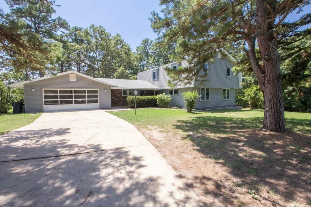 This incredible, entirely remodeled home from ground has exquisite upgrades. Includes 2 master bedrooms, one with a whirlpool tub, sauna, Bluetooth & foot massager with double vanity. 2nd master with walk in shower with Bluetooth & multi spray. Bamboo flooring in formal d/r, eat in kitchen & breakfast nook area. Granite throughout, high efficient low heat LED recessed lights thru out on rheostats. Sun room, large deck, new kitchen w/ stainless appliances & backsplash, vessel sinks in all baths. Waterfall entrance to house w/ tiled porch. New R12 insulation in walls, new R32 insulation in ceilings, new electric wiring, new plumbing, new roof, new walls, new fixtures, new Anderson windows. Easement walkway to lake. Too many amenities to list. One slip in a 20 community dock, for an extra $25,000. Extra lot to west for pool or what you desire for an extra $35,000.
