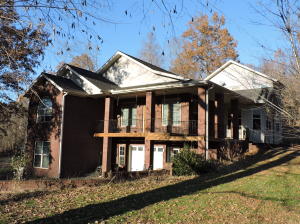 Beautiful home in the Ozark Mountains near Harrison, Ar and Branson, Mo. Excellent condition with open floor plan, cathedral ceilings, large rooms, gas log fireplace, nice eat-in kitchen with custom cabinets and breakfast bar. Formal dining room, spacious living room, large master bedroom with walk-in closet and big bathroom with shower and plumbed for tub. Den/Rec room in basement along with a 2nd master suite including a large bathroom with jetted tub. Perfect for mother-in-law suite or guests. Other features include an office area, workshop, kitchenette in basement. Nestled onto a tree-shaded park-like 2 acres with paved road frontage. Safe room/storm cellar in basement.