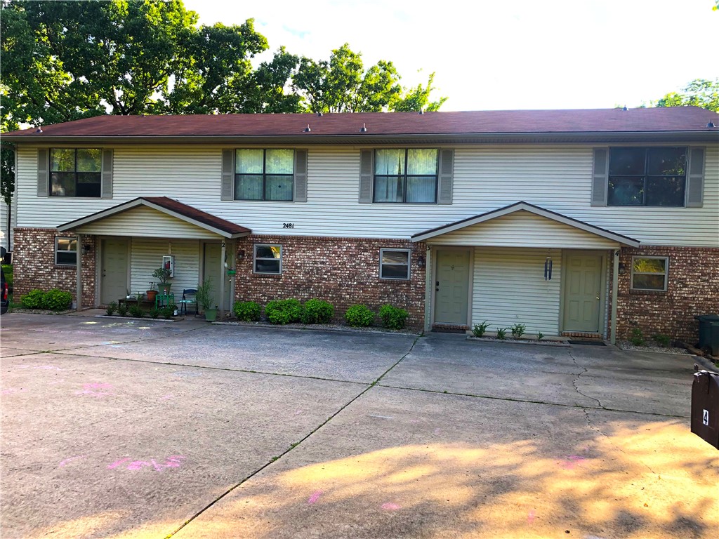 Superb location in center of Fayetteville @Township & College. Roomy, cute 2 bedroom, 1.5 bath townhome can be leased unfurnished $950/month OR furnished $1,300/month OR furnished w/utilities $1,500/month. Refrigerator, washer, dryer and lawn care provided. Wood-burning fireplace, carpet in living, stairs, bedrooms. Tons of storage. Rear bedroom has deck. Storm doors on both upper/lower rear doors. Two reserved parking spots. Pet negotiable w/non-refundable deposit. There is not a fenced yard. Unit #3. Less than 1 mile east or west to park or trails. Tenant pays Swepco electric, City of Fayetteville water and trash. There is no gas. Available 7/31/2021.