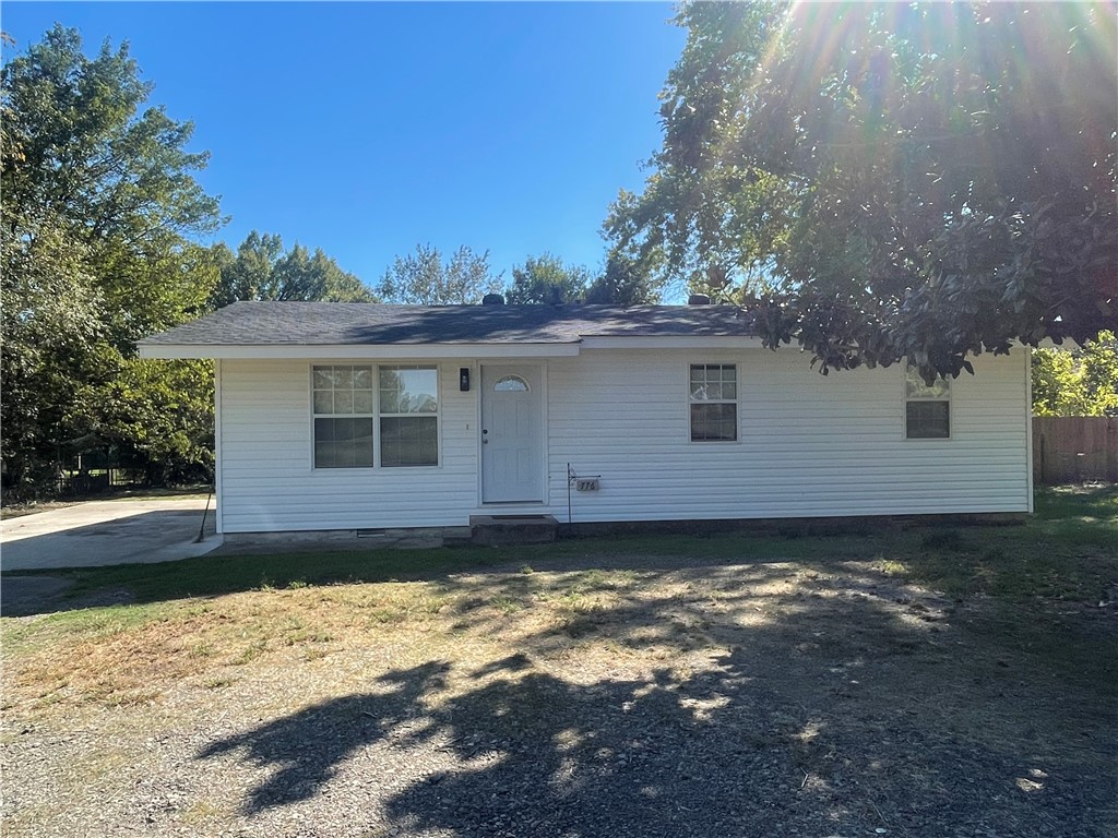 Imagine a CHARMING, COTTAGE HOUSE sitting on the edge of a quiet, rural town, just a short walk to the local schools. This PRISTINE AND ADORABLE home offers updated lighting, wiring, plumbing, insulation, etc. The new concrete carport and gravel driveway which was installed in 2020 give ample room for parking. The delightful kitchen has oak cabinets and NEW STAINLESS STEEL APPLIANCES that were installed in 2026. A new roof was installed in 2025, giving you the peace of mind of a major upgrade already completed and one less expense to worry about for years to come. Though in city limits, it has a country setting with a distant view of mountains.  Open, large living room provides a warm and inviting space. Huge patio area to enjoy the outside. No mineral rights to convey.