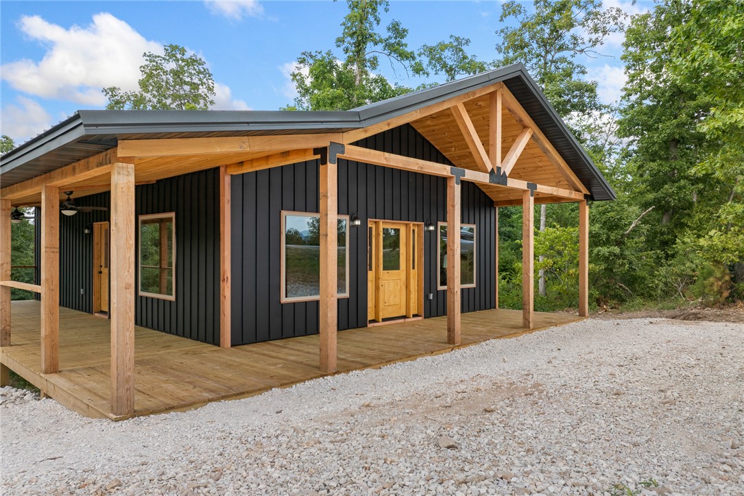 Excellent location just off Hwy 74 in Jasper, Arkansas, minutes from the Jasper Square and the Hasty access of the Buffalo National River. Built in 2025, this 2-bedroom, 2-bath home offers an open floor plan and is perfectly positioned for use as a nightly rental in one of the Ozarks' most popular tourist destinations.

The property is being sold fully furnished and includes all furniture, appliances, linens, kitchenware, and household contents. From day one, it's ready for personal enjoyment or immediate rental income. Features include a matte black steel board-and-batten exterior, metal roof, central HVAC, and low-maintenance construction.

Situated on over 7 acres, the property provides privacy, room to roam, and space for a second cabin or future expansion. Whether you're looking for an investment property, weekend getaway, or full-time residence, this turnkey Jasper property is ready to go.