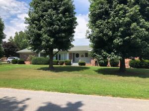 This BR/2 BA  all brick home features a den with a large brick fireplace;  formal living room; covered patio; fenced back yard; 2 car garage; and sits on a corner lot.