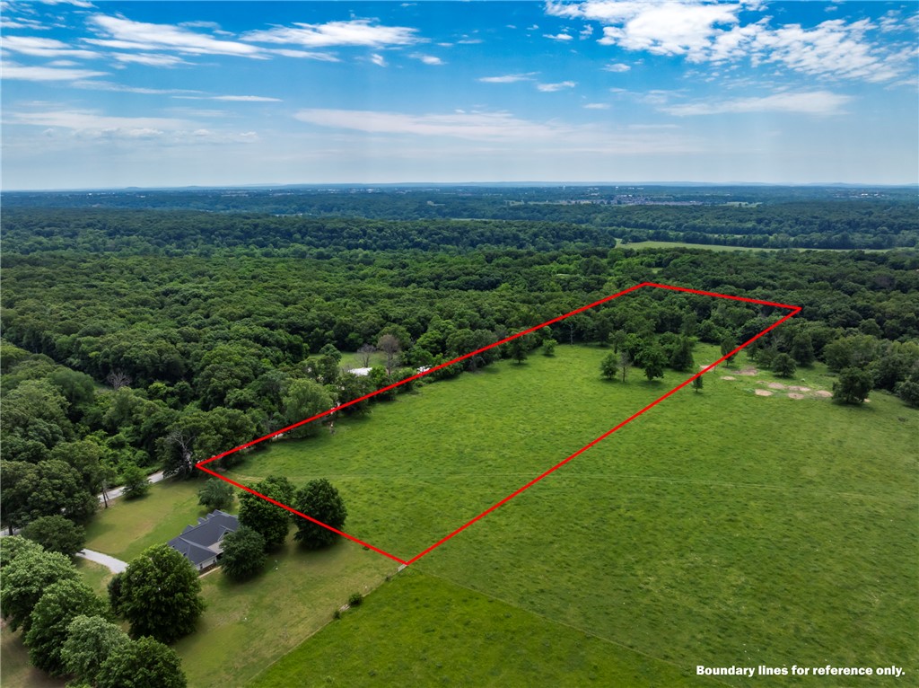 The ideal blend of convenience, privacy, and potential! Photos with sketched in boundary lines are just approximations. Paved road and rural water available. Exact acreage and legal description is subject to a new survey, splitting approximately the east 10 acres from a 52 acre parcel. Also listing the entire 52 acre parcel, See MLS#1347742. Also listed as 25 Acre parcel MLS#1347744 and listed as 37 acre parcel MLS#1328527.