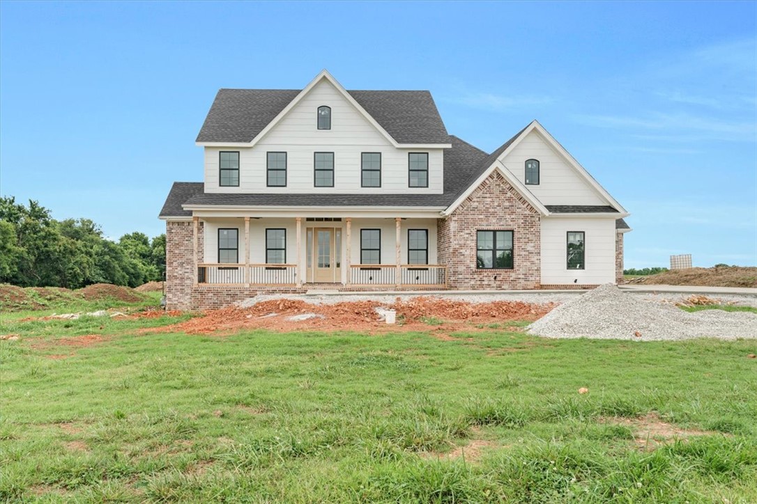 Look forward to coming home to Springdale newest Subdivision, Magnolia Meadows off Harmon Rd
Fayetteville Address, Springdale Schools, near Tontitown. One acre lots, 3 car garage, 3200 - 3800 sq ft
homes planned. Just getting started but this home has 5 bedrooms, 4.5 bathrooms, study and media room. Front porch, back deck and all the space you need. Sprinkler system will be installed for the sodded areas of the yard as well.  Come check it out.