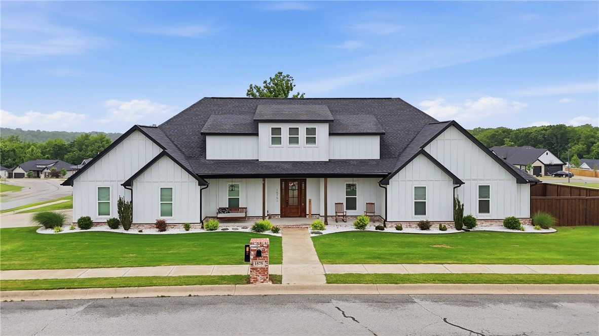 This almost-new 1 level home sits on a large flat corner lot in Big Sugar Golf Community neighborhood. This immaculate home features 4 bedrooms, 2.5 baths, an office & tons of storage space with a 3-car garage, oversized mudroom & large laundry room. Enjoy the unobstructed views from the covered 300sqft back patio. Inside find custom craftsmanship & soaring ceilings that elevate the entire interior. Beautiful new wood floors flow throughout the open-concept living space which flows perfectly for everyday living & entertaining. The kitchen features white cabinets, leathered granite countertops, stainless appliances, 5-burner gas cooktop & a large pantry. The primary ensuite has been updated with a new tile walk-in shower, garden tub, dual vanities w/ quartz counters & walk-in closets. The large fully fenced backyard offers versatile access w/ both a single & double gate, while the west-facing side yard is an ideal space for a garden. Neighborhood is on the drone delivery service from Wal-Mart Neighborhood Market.