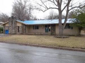 A ton of potential with this 1988 sq.ft. 3BR/2BA home on .9 acres m/l with large living room, fenced yard on low traffic street & much more. Property is being sold As-Is. Bank owned, owner does not make any representation or warranties. Cash & conventional financing available. All #'s are approx, age is estimate, sq. footage per assessor.