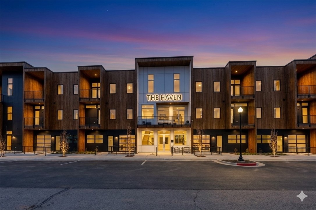 LUXURY PENTHOUSE LIVING IN THE HAVEN. The Chihuly Penthouse, a stunning corner unit with expansive southern views of The Momentary. Located between the Walmart Campus and the Downtown Bentonville Square, this residence offers elevated, walkable city living with access to world-class art, culture, and dining. Step into a bright and airy living space with soaring 14’ ceilings, an open-concept layout, and a gourmet kitchen featuring BOSCH paneled appliances, induction cooktop and a custom white oak cabinets. Enjoy the outdoor views from one of your two private balconies. Off the primary suite you have a spacious walk-in closet with build-ins and a spa like bath with a shower featuring BRIZO fixtures including a rain showerhead. The secondary bedroom is perfect for guest or an office. The HAVEN offers 29 luxury residences with private garages and secure building access. This penthouse offers privacy, prestige, and proximity to everything that makes Bentonville unique, perfect for a second home or a primary residence.
