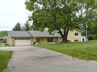 Spacious tri-level home on 1.5 acres, in an ideal location. Newly finished with laminate flooring. Beautiful 5-bedroom home offers space, convenience, and room to grow; this property boasts an additional 900 sq/ft detached building equipped with HVAC & electric, making it ideal for a workshop, office, or studio. Patio built in 2021, new roof in 2021.