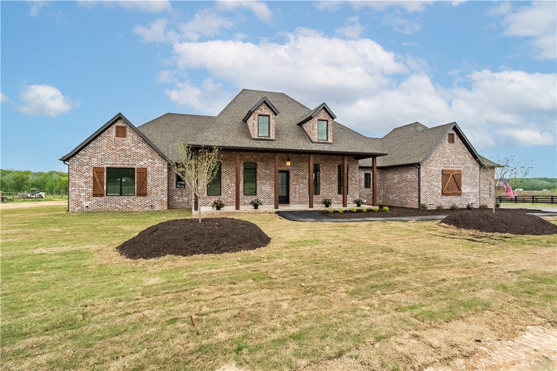 Gorgeous new construction on 3 acre estate lot!!  Quiet country setting yet located within 30 minutes of downtown Bentonville or Fayetteville!! This home is one level, perfect for families and entertaining. Massive outdoor living with wood burning fireplace overlooking quiet valley gives you something you can't find in the city but yet close enough for a grocery or dinner run! With the new bypass en-route, you'll be able to be anywhere in Northwest Arkansas in no time! Natural gas and city water as well! Come take a look today!!!  Lot is part of Three Springs Subdivision, a nine lot large estate subdivision. See also MLS 1275710 and 1270051.