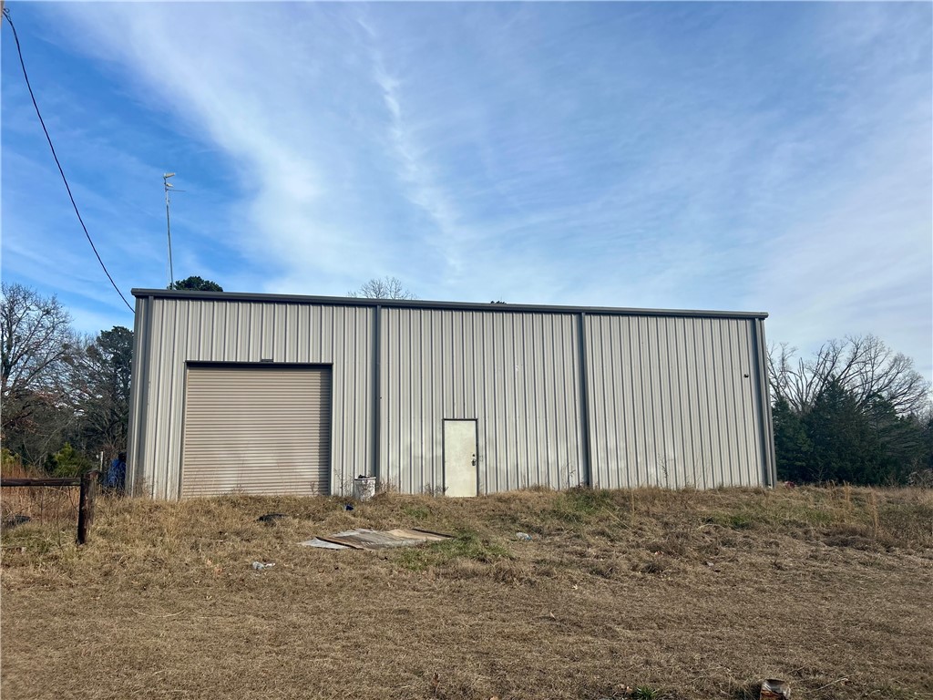 Discover the possibilities with this 40x60 shop building situated on 8 beautiful acres, partially cleared and partially wooded offering the perfect blend of open space and privacy. The shop is equipped with electric, making it ideal for immediate use or future expansion. Whether you're dreaming of building your custom home, creating a shophouse or barn dominium, or needing a spacious workshop or storage area, this property offers endless potential. Enjoy the peaceful country setting while still having room to grow, explore, and design a space that fits your lifestyle. A rare opportunity to own acreage with improvements already in place-bring your vision and make it your own!