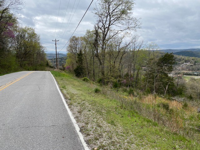 Fabulous view !  Table Rock Lake sparkles in the near distance.  This all only enhanced by darkness falling, as twinkling lights from houses below, Holiday Island Marina, fall against the backdrop of starry skies.  Build your house with a deck across the back, you will never want to go inside.  See also MLS 1182262.  These two lots are to be sold together, totaling .920 ac.  The price is a TOTAL, both lots for $ 60,000