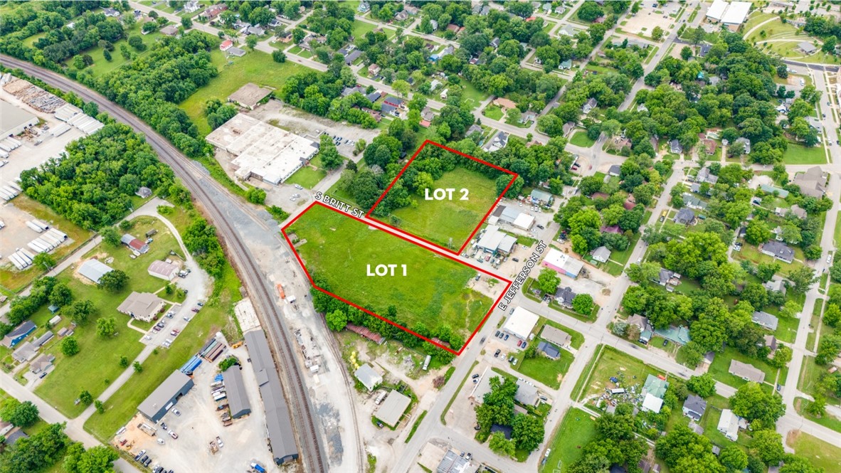Two lots ready for development within an industrial corridor of Siloam Springs. Property has access to major highways, the Arkansas-Missouri railroad, and Oklahoma. Seamlessly improve your distribution and manufacturing needs in this rapidly growing area of Northwest Arkansas.

Approved flex warehouse plans available to transfer with sale.
Lot 1 features direct Arkansas-Missouri Railroad access.
Flat, cleared, and ready for development. 
Versatile zoning allowing for multiple uses.
Centrally located in town, & minutes from Hwy 412 & Oklahoma.
Lots to be purchased as a package.