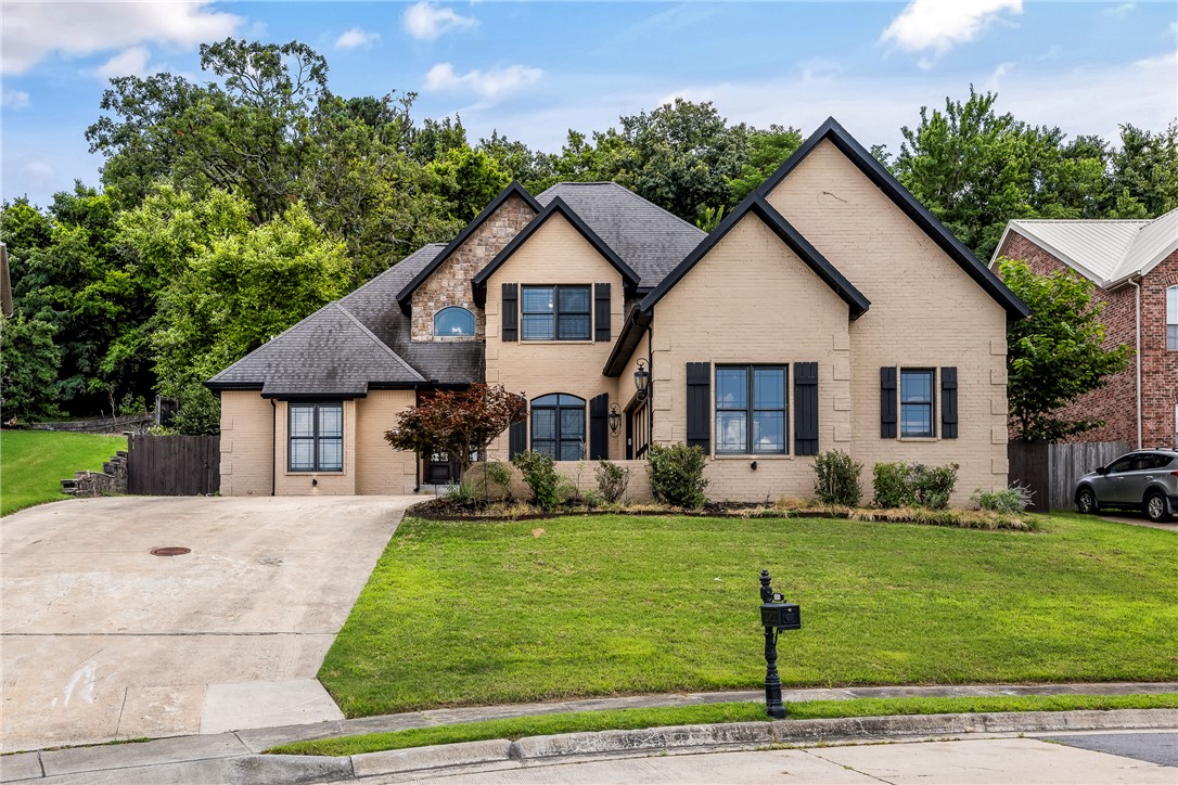 The Best of Fayetteville at our fingertips. 5-bedroom, 3.5-bath home in the Mission Hills placed in the heart of the City. Step outside and onto the Razorback Greenway — the trail literally begins at your street entrance — connecting you effortlessly to Gulley Park, the Fayetteville Square, and the University of Arkansas. Root Elementary and Woodland Junior High are just minutes away, making the morning school run a breeze. The main level flows openly from a spacious kitchen into the living area, where warm fireplaces anchor the space. Coffee or wine sipping shaded sitting are off the kitchen. A dedicated media room offers the perfect retreat for movie nights or game-day watch parties. The main-floor primary suite provides a quiet, private escape, while a main-level guest bedroom and a separate office round out the downstairs — ideal for hosting visitors or working from home without sacrificing a bedroom.