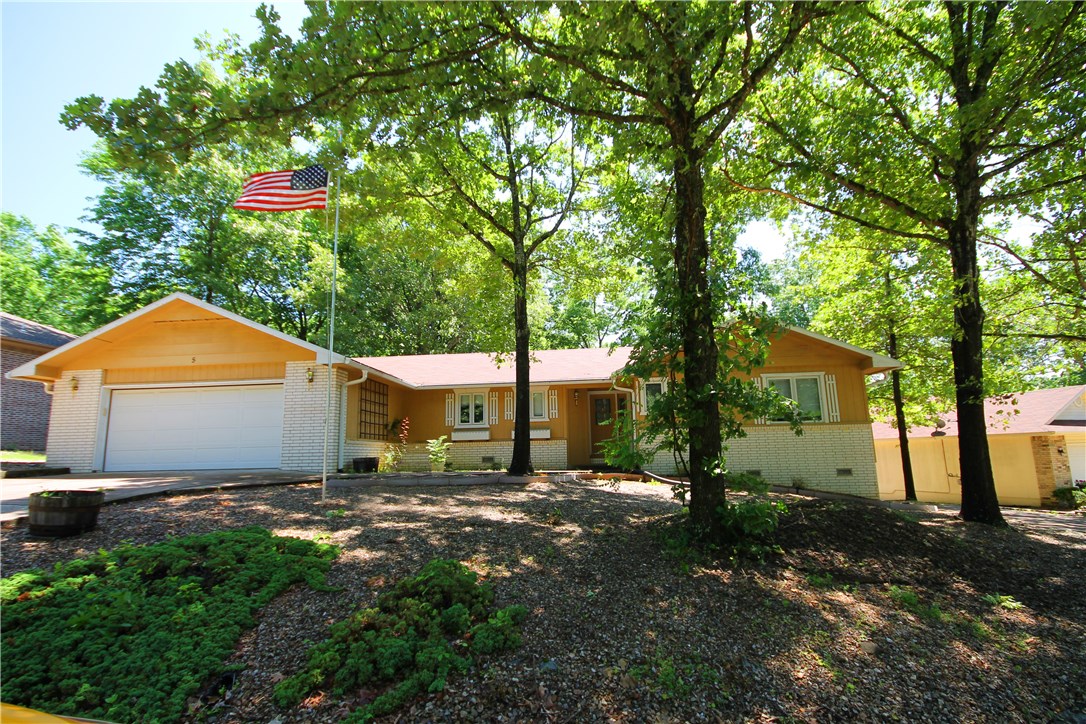 Great 2 bedroom 2 bath home with a sunroom and a bonus room. Located close to Lake and the Boat Launch, this home features: split bedroom plan, open living space, wood burning fireplace, all appliances come included, extra large 2 car garage with sink, bonus room off the master bath/garage, perfect for a hobby room, nursery, workout room, office.