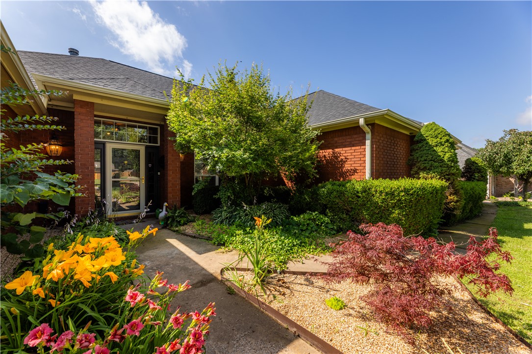 Welcome home to this stunning 4-bedroom, 3-bath retreat with a sparkling pool. Soaring high ceilings and a thoughtful split floorplan create the perfect blend of open living and private space. The kitchen sits at the heart of the home — a true hub for gathering, cooking, and connecting. Step outside to a beautifully landscaped yard made for entertaining, featuring an extended patio, lush greenery, and a refreshing pool. Located in a sweet, quiet, and walkable community just minutes from the Razorback Greenway and JB Hunt Elementary, this home checks every box for lifestyle and location. And the updates? They've done the work for you — new fence, pool pump, concrete patio extension, fans, light fixtures, mirrors, flooring, irrigation upgrades, french drain, and fresh paint throughout — most completed in 2024–2026. Move-in ready, meticulously maintained, and full of heart.