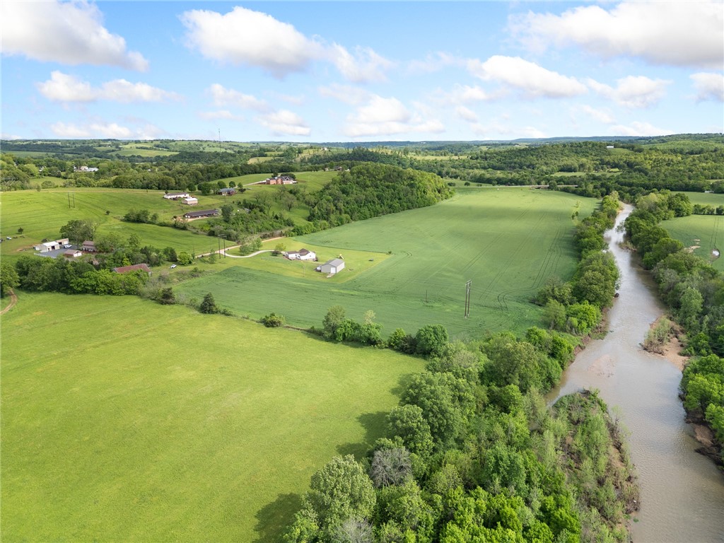 Looking for farmland??  Here it is!!!  119.5 ac m/l just outside of Alpena, AR, two tracts, both have Long Creek frontage.  The property is currently producing income by being planted in wheat, followed by soybeans, but could easily be used as hay fields or cattle grazing.  The tract off of US 412 has a 65 x 60 equipment barn equipped with electric and water.  This farm is well-maintained and ready for its next owner and their business venture.