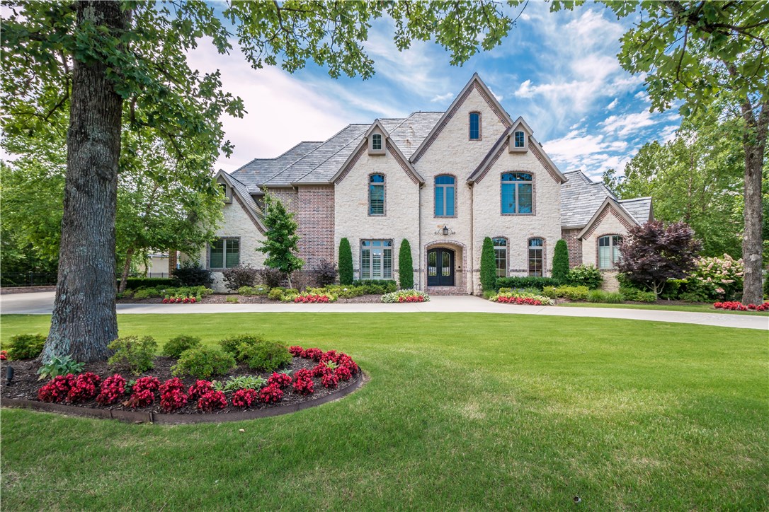 Stunning golf front estate located in the prestigious Pinnacle Country Club!  This immaculate custom built home offers 5 bedrooms and an inviting open floor plan with thoughtful design and layout.  Exceptional features including curved staircase, wine room, floor to ceiling windows, 4 living areas, 3 fireplaces and a gourmet kitchen with 2 islands!  The lower level boast a recreation room, kitchen, media room, exercise room, lower garage/storage and an additional en suite guest room.  Entertain or relax on the generous .81 lot offering lush landscaping, spacious deck & patios, sport court and enjoy the exquisite views of the golf course