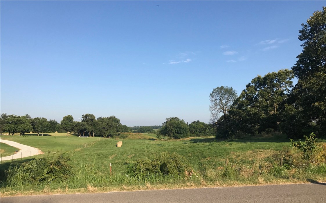 Conveniently located off Highway 412W, this 3 acre property would be the perfect place to build your dream home. Gorgeous, rolling land features open pasture.  Acreage dimensions are approximately 144.28’ x 904.75’.  Survey & soil test available.  Zoned R-3.  Building setbacks: Front 20', Side 10', and Rear 25'.