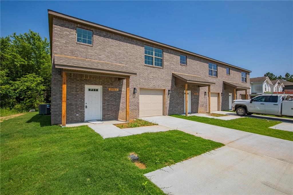 New Construction Tri-Plex in Siloam Springs. 3 bedrooms 2.5 baths. Main living area has vinyl plank wood style flooring through main living area, carpet in bedrooms. Kitchen features granite counters and stainless appliances, includes refrigerator, over range microwave and pantry. 1/2 bath on main level. 3 bedroom and 2 full baths upstairs. Also included washer and dryer. Fenced yard.
