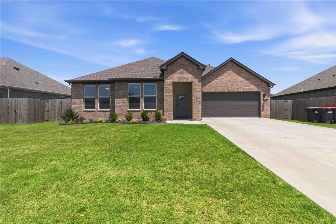 Built in 2023, this 4-bedroom, 2-bath home offers a bright, open layout with the kind of finishes buyers are asking for right now. The kitchen is truly the heart of the home, featuring a large quartz island, stainless steel appliances, subway tile backsplash, generous cabinet space, and a walk-in pantry. It opens seamlessly to the dining area and living room, where a fireplace adds warmth and character to the space.
The primary suite is spacious and inviting, with dual vanities, a large tiled shower, and a walk-in closet. Throughout the home, you’ll find durable LVP flooring, updated lighting, and a clean, modern feel.
Out back, the covered patio and fenced yard provide plenty of room to relax, entertain, or let kids and pets play. With a thoughtful floor plan, stylish finishes, and move-in ready condition, this home offers comfort, function, and everyday livability.