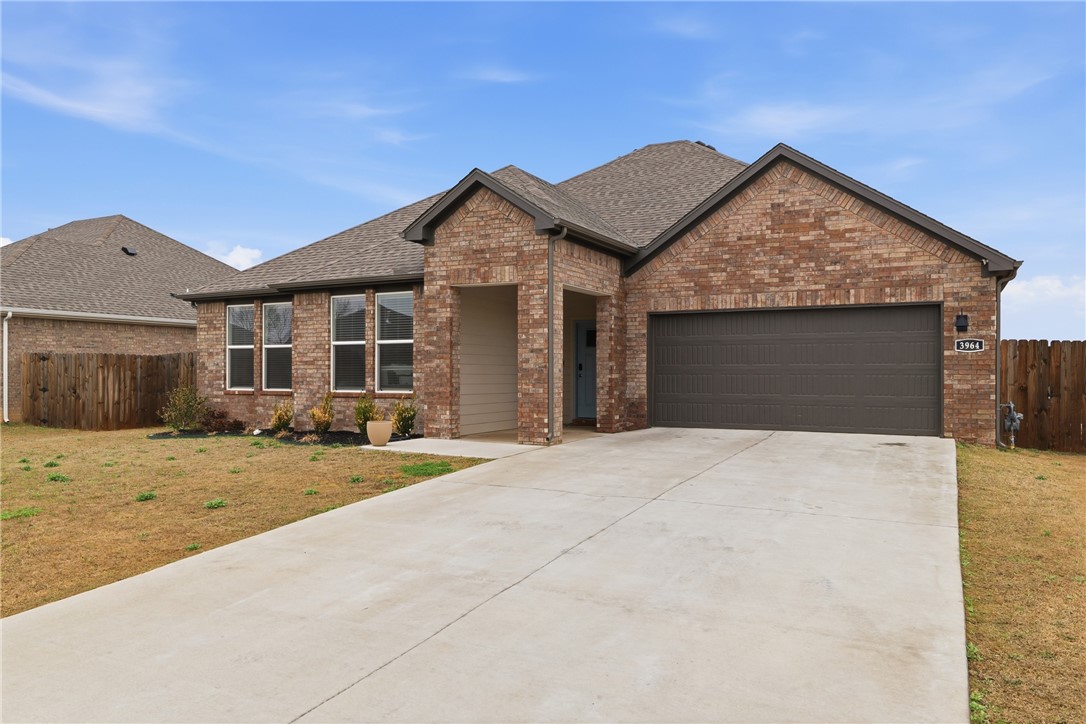 Built in 2023, this 4-bedroom, 2-bath home offers a bright, open layout with the kind of finishes buyers are asking for right now. The kitchen is truly the heart of the home, featuring a large quartz island, stainless steel appliances, subway tile backsplash, generous cabinet space, and a walk-in pantry. It opens seamlessly to the dining area and living room, where a fireplace adds warmth and character to the space.
The primary suite is spacious and inviting, with dual vanities, a large tiled shower, and a walk-in closet. Throughout the home, you’ll find durable LVP flooring, updated lighting, and a clean, modern feel.
Out back, the covered patio and fenced yard provide plenty of room to relax, entertain, or let kids and pets play. With a thoughtful floor plan, stylish finishes, and move-in ready condition, this home offers comfort, function, and everyday livability.