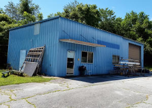 This property is located at Bear Creek less than a quarter of a mile off Hwy 412 with 200 feet of old Hwy 65 frontage. Beside the 1830 Sq. Ft. shop with office area, 1 bath and large 18'6'' wide X 14'tall overhead door & 16' sidewalls, there is ALSO a 500 Sq. Ft. 1 or 2 bedroom mobile home. Mobile home would be great for extra rental income. This property is priced far below replacement costs and would be an excellent opportunity for someone wanting or needing a large workshop with rental income property included that is only a short distance out of Harrison and very close to Hwy 412 without having to pay that TOP DOLLAR price for Hwy 412 property. 3 phase electric is available. Beside the two electric wall heaters in the shop. OFFERS ARE SUBJECT TO COURT APPROVAL!