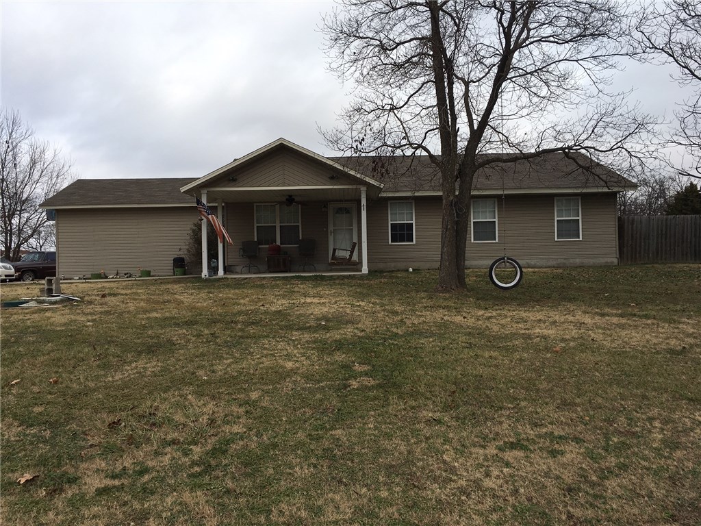 Large corner lot with fenced backyard and storage building.  Total electric with reasonable utility bills.  Beautifully maintained with wood laminate, tile and carpet.  Perfect home for the first time buyer.