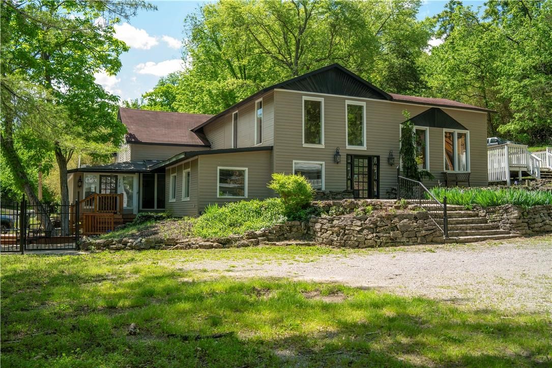 Incredible 4,700 sq ft commercial building in the heart of downtown Eureka Springs! Located on a prominent corner lot on Main Street, this unique property is ready for its next chapter. Recently remodeled, it features a commercial kitchen layout, retail space, and private living quarters. The current owner and her late husband lovingly renovated the property with dreams of opening a gathering place for the community. Sadly, he passed away just before they could bring that vision to life, leaving this beautiful space ready for someone new to continue the story. Huge side deck and spacious patio perfect for outdoor dining, live music, or special events. The flexible layout could suit a café, wine bar, boutique, or mixed-use concept. A rare downtown bonus: a private parking lot that could generate income. With the potential to develop three nightly rental units or convert into the home of your dreams, the possibilities are endless. Historic charm meets versatility just steps from galleries, shops, scenic trails.