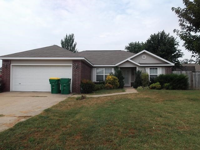 Quaint 3 bedroom home in quiet neighborhood features a privacy fenced back yard with mature trees, an outbuilding to use as a shop or for storage, and a storm shelter. Home is move-in ready!