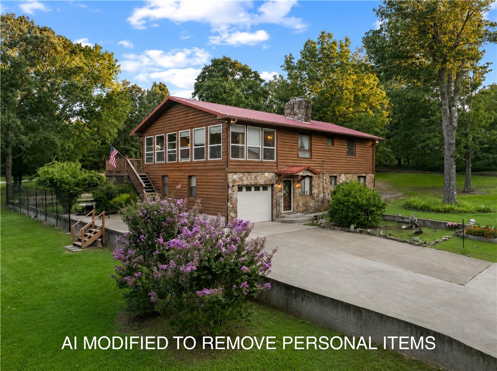 Nestled on nearly 1.5 acres comprised of six city lots, this log cabin-style 3-bedroom, 3-bath home offers privacy, beauty, and versatility just minutes from Bull Shoals Lake. Mature trees, beautiful landscaping, and a fenced inner backyard create an inviting setting with ample room to add a swimming pool. The main level features heated LVP flooring and comfortable living spaces, while the upper level offers a kitchen with Cambria quartz countertops, a sunroom filled with natural light, beautiful bamboo wood flooring throughout the living areas, and all bathrooms feature granite countertops. Enjoy outdoor living from two porches, including a spacious rear deck overlooking the backyard. An attached one-car garage provides convenient access to the home, while the detached two-car garage with workshop space offers room for vehicles, storage, hobbies, or lake toys. With road frontage on three sides, this property is ideal as a full-time residence or weekend retreat near Bull Shoals Lake.