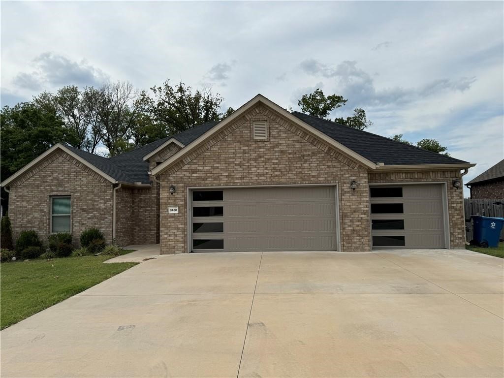 Beautiful Brick Home with 4 Bedrooms and 3 full bathrooms. This home has the desirable three car garage. The pantry adds additional storage space which is always a plus. Gas fireplace and an open kitchen to the living room. Kitchen features custom cabinets, granite counter-tops. The master has a custom tiled shower and large soaker tub.This home is located in an established neighborhood that includes a dog park and pool! Located just 10 minutes from the Walmart home office or interstate.