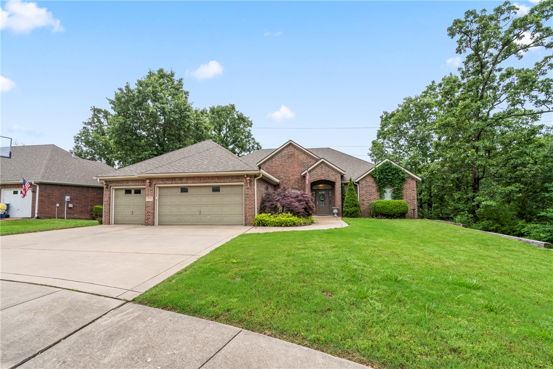 This attractive residence is designed for flexibility, comfort and ease. The kitchen features a built in oven, microwave and granite counters, all centered around an island perfect for both meal preparation. This spacious 2,519 SF home has 4 BR, 3 BA, two living areas, a formal dining room, eat in kitchen and multiple access doors to the two level covered outdoor living and entertaining spaces that are surrounded by woods for privacy and situated on .55 acres. The rooms flow from the entry way to the formal dining room and living area. The split floor plan offers 2 bedrooms on either side of the main living area. The main BR is adjacent to the bathroom w/ double sinks, walk-in closet and is accessed from either side of the shower. The laundry room has a sink & washer & dryer can convey. 3 car garage has epoxy floors and built in stainless steel cabinets. Two refrigerators, washer & dryer, whole house generator and stainless cabinets in garage can convey. Some furniture may convey, if desired. Storage bldg. conveys.