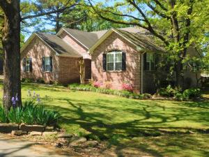 You'll definitely want to see this spacious home just off Marina Road. From the great curb appeal with beautiful brick and side entry garage, to the large open living room with wood burning fireplace and built-in shelving...this house will not disappoint. Hardwood floors, large remodeled master bath, huge deck, .72 acre lot, and much more are yours at this great location!