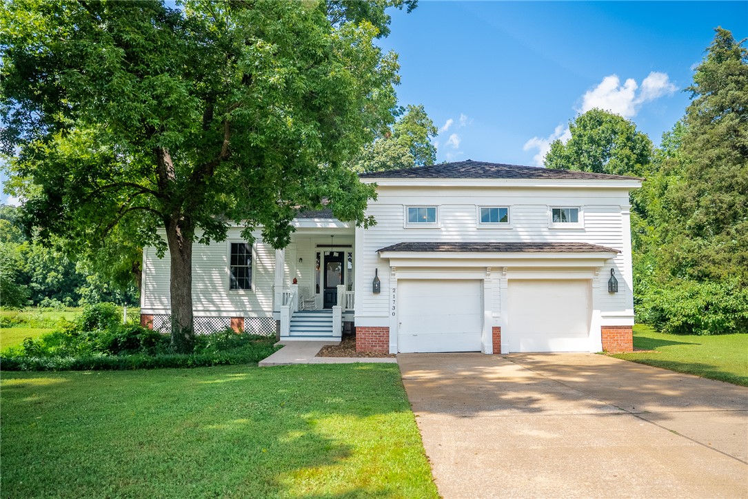 Welcome to this custom- built replica of the historic Royston House, where timeless elegance meets modern comfort. Nestled on 1 acre in a tranquil setting on a quiet cul-de-sac, this 2,592 sq.ft. home offers 3 BR’s, 3.5 BA’s with each BR featuring its own private en-suite bath. 14 Ft. ceilings, oversized Pella windows and hardwood floors throughout showcase the quality and character of this home. Enjoy 4 fireplaces in the LR, DR, and 2 BR’s. Recent upgrades include a full kitchen remodel, primary BR/BA remodel, new front porch, entry, and doorway, plus many additional improvements completed by the owners.  Thoughtfully updated and beautifully maintained, this home is ready for your personal touches. Located just minutes from scenic walking trails, & City Lake Park, this unique home blends historic charm, modern touches, & a tranquil setting. Homes with this level of character are a rare find!