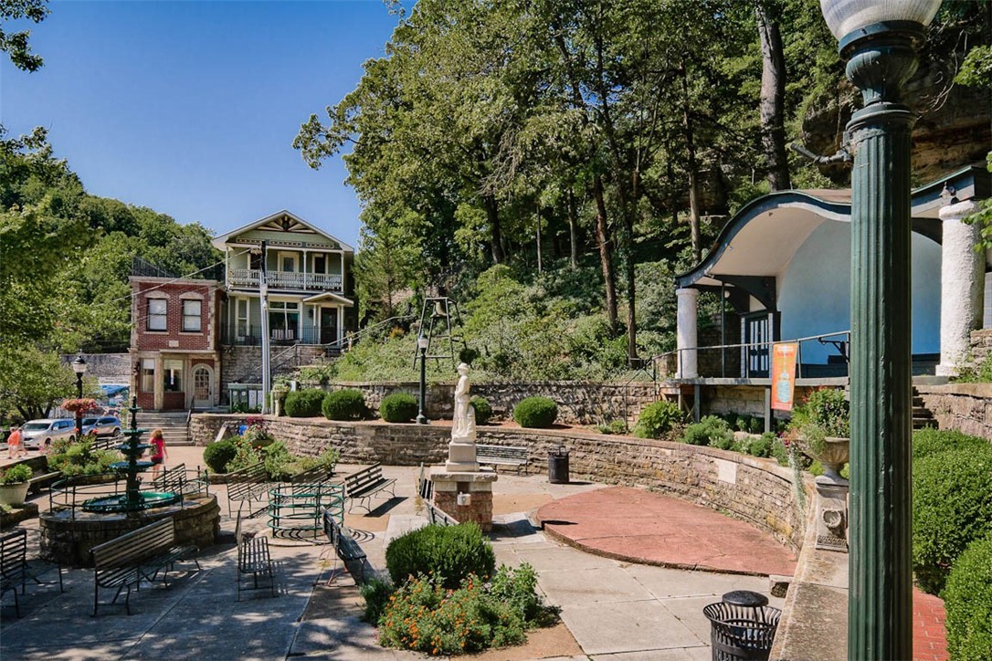 Location, Location, Location...TWO Meticulously Renovated Commercial Structures Located in The Heart of The Downtown Historic District of Eureka Springs. Presently, the brick structure has TWO Turnkey overnight lodging units and the wood structure is a monthly rental. Potential Applications For This Premier location are only limited to Your Vision. Watch from Above, while on the multiple patio areas, Frequent Festivities and Parades That Occur in and Around the Basin Spring Park. Oh What FUN Creating Memorable Life-Changing Experiences in The Town That Water Built!!!