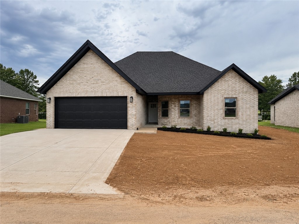 TO BE BUILT. Perfect time for you to pick out finishes! Discover the "Cambridge" plan, ideally situated close to the Pea Ridge High School and trails! Just 15 minutes from the new Walmart Campus! This beautiful home features 4 spacious bedrooms / 2.5 baths and a split floor plan. Enjoy the flexibility of a 3-car garage and the elegance of custom cabinets throughout. The kitchen includes a gas range and a huge island perfect for gatherings. Step out to the covered patio for outdoor relaxation and entertaining. $5,000 in buyer's closing costs from the builder's preferred lender. Schedule your showing today!