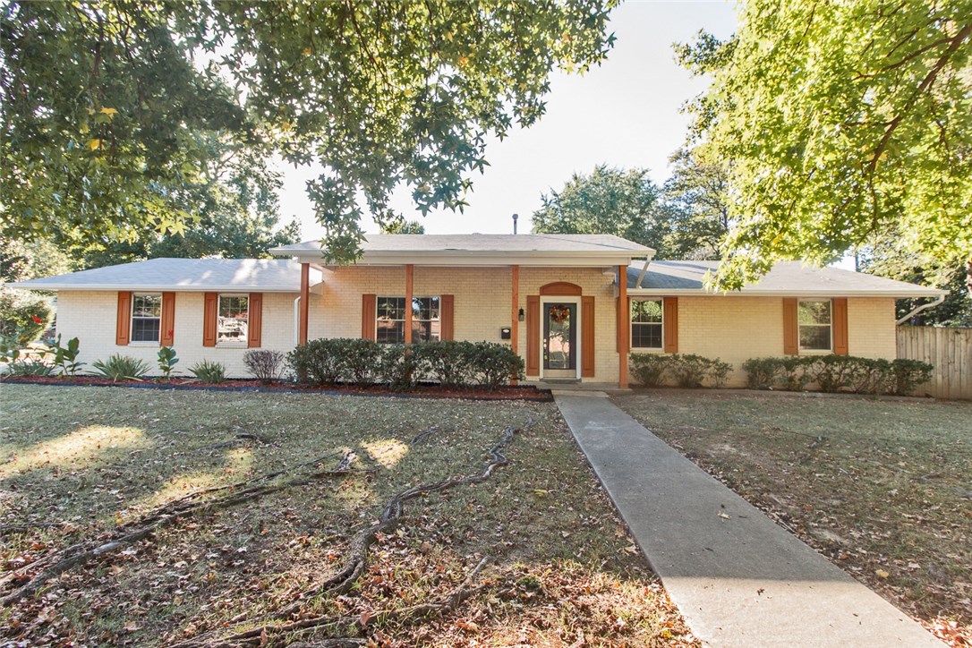 All brick home in established neighborhood, close to schools & shopping. Recently added Mstr BR en-suite makes this 4/3 with oversized garage, on lg crnr lot, 2 living areas including a 20X20 Family Room, one of the best buys in all of Rogers. All new cabinets, counter tops, back splash, matching appliances and butcher block brkfst bar while 2nd LR features WB FP with slate tile surround and gas starter. Fresh paint inside and out, new gutters, exterior lights, brand new furnace, 1yr Home Warranty.